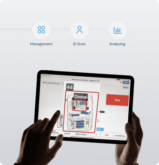 A person holding an iPad displaying a map, highlighting AI-powered weapons detection technology for security assessments.